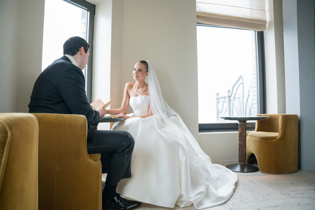 bride is staring at her groom as they exchange wedding vows